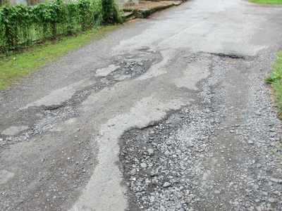 Why Potholes Are Bad For Your Car